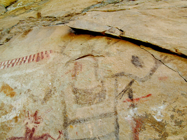 Central figure, with cowboy hat and elk antlers