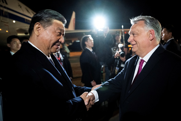 Hungarian Prime Minister Viktor Orban welcomes Chinese President Xi Jinping at the Ferenc Liszt International Airport in Budapest, Hungary, on May 8 2024.