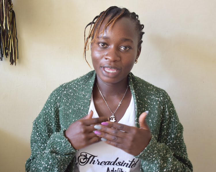 Becky Adeli wearing her own hand made sweater as she explains about her company ThreadsIntel in Daystar University Athi River Campus on February 13