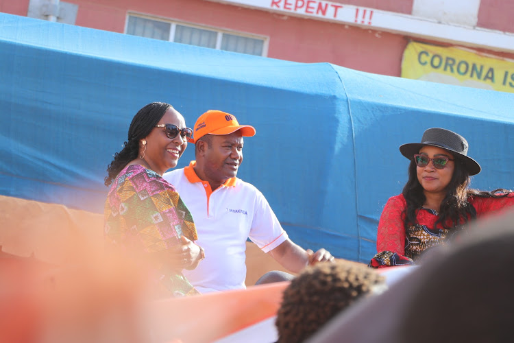 Taita Taveta gubernatorial candidates Patience Nyange, Tom Mwakwida and woman representative candidate Joyce Lay share a podium during an Azimio joint rally at Voi bus park on Friday, July 22.