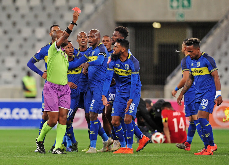 Kermit Erasmus (R) of Cape Town City is given a straight red card by referee Eugene Mdluli for his horrendous foul on Mothobi Mvala of Highlands Park (lying down) during the 1-1 Absa Premiership draw at Cape Town Stadium on April 23 2019.