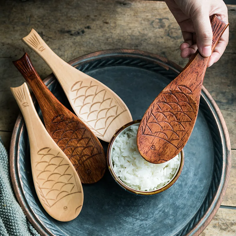 Non-stick Houten Rijstlepel voor Thuis Serveer perfecte, niet-klevende rijst met deze handige en duurzame houten rijstlepel voor dagelijks gebruik.