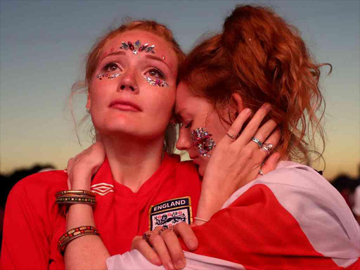 England fans look dejected at Hyde Park in London after the World Cup's 2-1 defeat by Croatia, July 11, 2018. /REUTERS