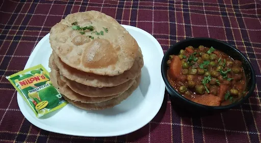 8 Puri With Seasonal Veg And Curd