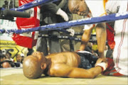 MSOPI ON THE FLOOR AFTER TAKING  HEAVY BLOWS FROM MFUNDO GWAYANA during A  SA JUNIOR FLYWEIGHT TITLE BOUT, 29/ 06/08 PICTURE MICHAEL PINYANA