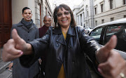 Cape Town Mayor Patricia de Lille celebrates outside the Cape Town High Court on Wednesday after her victory against her own party. 