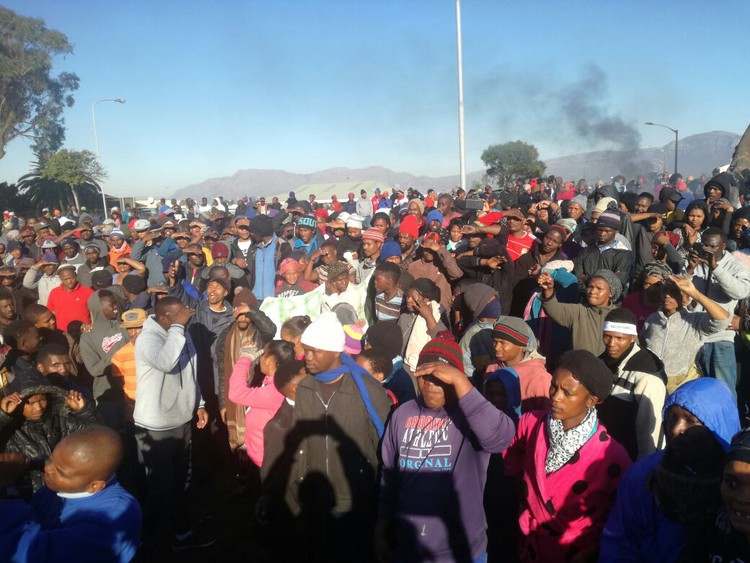 Protesters gather to hear Subcouncil Chairperson Shannen Rossouw.