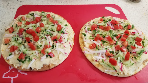 Flatbread, spread, veggies and cheese