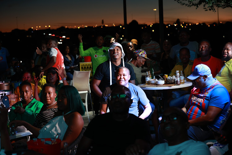 Fans watching Bafana Bafana and Nigeria at Disoufeng Pub Meadowlands Zone 10, Soweto.