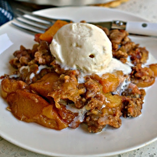 Made with common pantry ingredients this lightly sweetened fresh peach crisp is topped with a buttery cinnamon oatmeal topping.