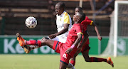 Phetholo Sekome of Jomo Cosmos tackled by Tiklas Thutlwa of Black Leopards. Lidoda Duvha is breathing a sigh of relief for escaping relegation.