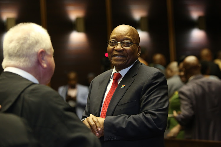 File photo of former President Jacob Zuma speaking to his advocate Mike Hellens after his case was postponed in the PMB High Court for his 3rd appearance on charges of fraud and corruption on July 27 2018.