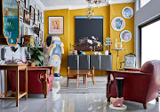 The quirky living room is jam-packed with contemporary art.