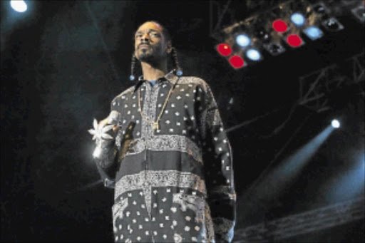 WEED LOVER: Snoop Dogg will be performing with his jewel encrusted marijuana leaf covered microphone at the Cannabis Cup. PHOTO: Associated Press