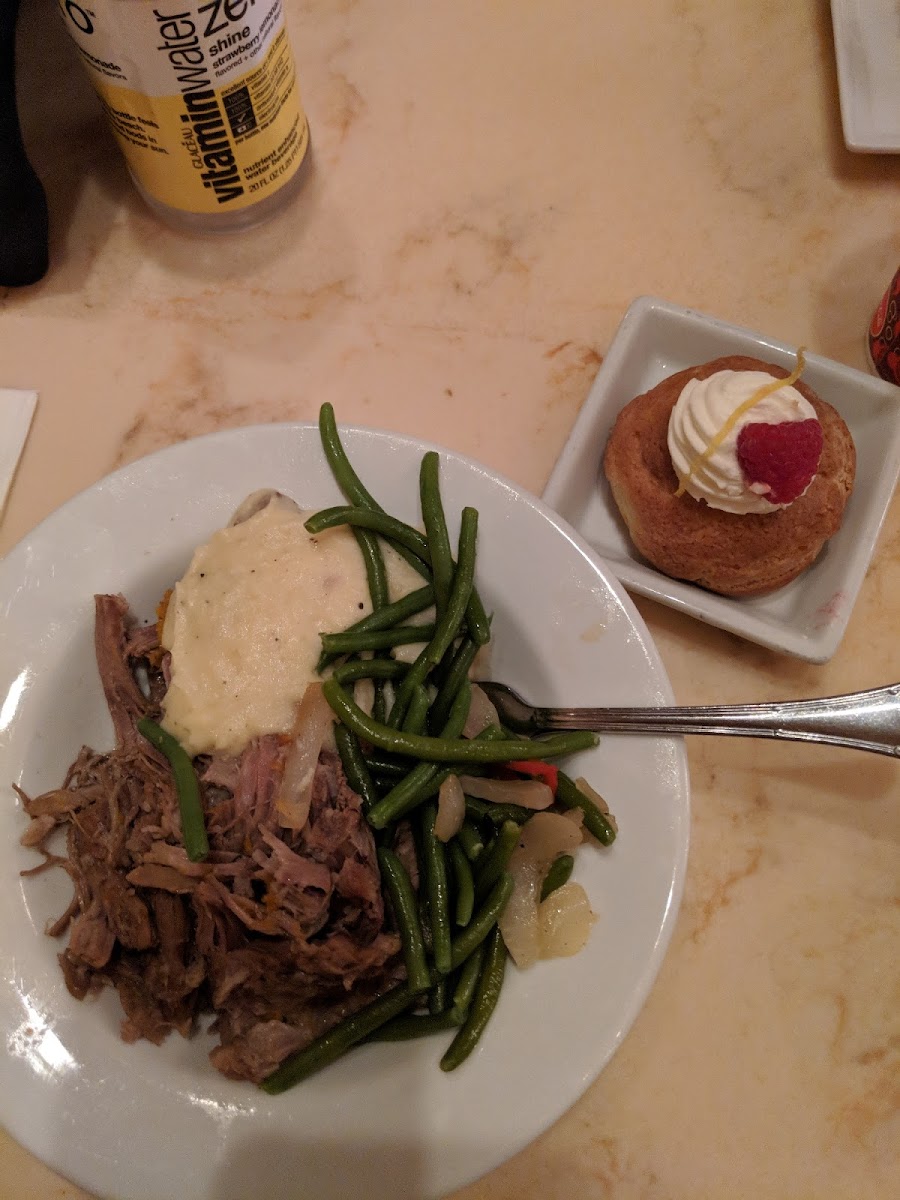 Pork, mashed potatoes and green beans with lemon and raspberry cream puff for desert!