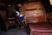 March 21, 2019: Phumzile Vilakazi hugs her autistic son Mxolisi who she was forced to chain to a chair to protect him. 