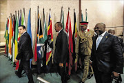 CONSPIRACY OF SILENCE:  President Uhuru Kenyatta of Kenya, centre, arrives at the Sixth Ordinary Session of the Third Parliament of the Pan African Parliament  held at  Gallagher Estate,Midrand
      Photo:  Moeletsi  Mabe