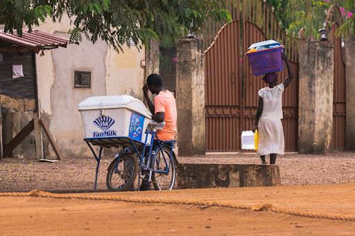 Fan milk ice-cream seller waiting for “closing time”