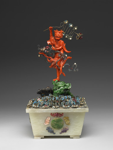 Planter with a coral carving of the planetary deity Kuixing