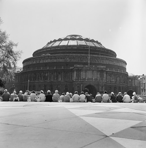 A group of seated women opposite The Royal Albert Hall, Westminster, London