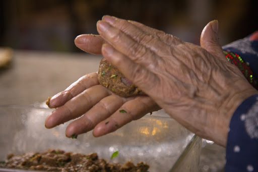 Close Up shot of all the spices put in the pan