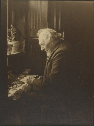 [Portrait of a Man Working at Desk]