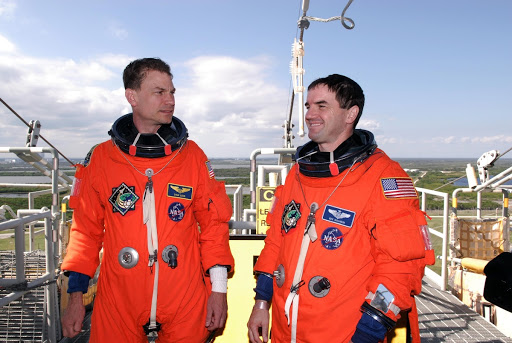 Mission Specialists Stanley Love and Rex Walheim relax for a moment following a launch countdown at Launch Pad 39A.