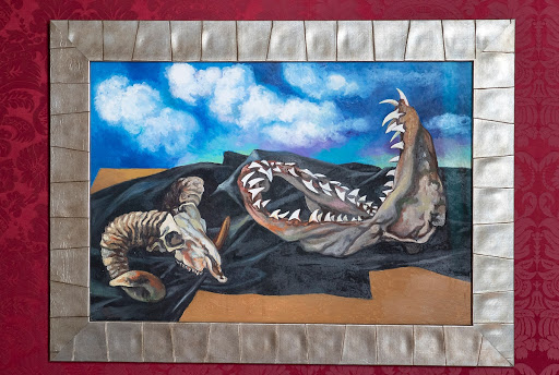 Bucranium, shark jaw and black cloth against the sky