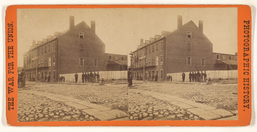 "Castle Thunder," Carey St., Richmond, Va., where so many Union prisoners were confined. (Verso)