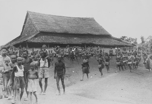 Muyu Papua people leaving the church after a Confirmation ceremony by father Tillemans