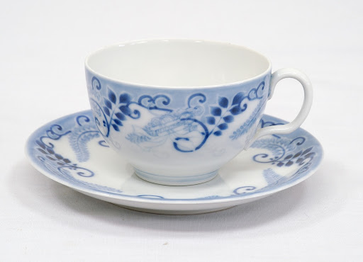 Teacup and saucer with wisteria design, blue and white