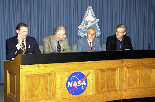 Space agency officials participate in a media briefing following the launch scrub of Space Shuttle mission STS-111.