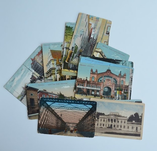 A collection of postcards withm images of pre-war Warsaw.