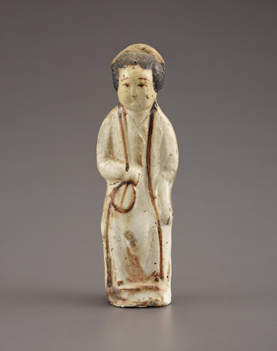 Female attendant holding a fan