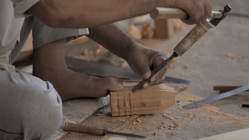 Inticately carving the wood