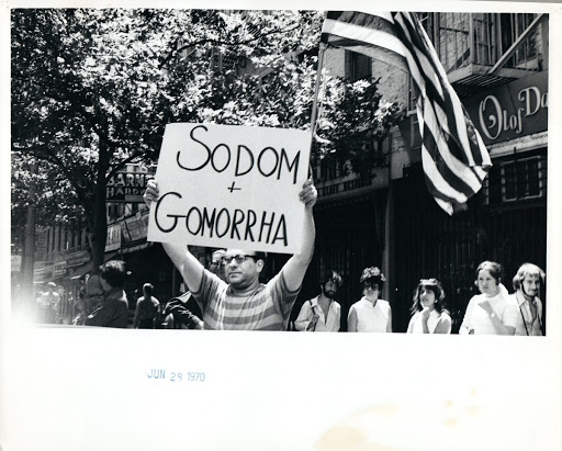 Countermarcher with"Sodom and Gomorra" sign at Christopher Street Liberation Day March, 1970