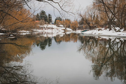 The Whitefish River winding through the city of Whitefish.