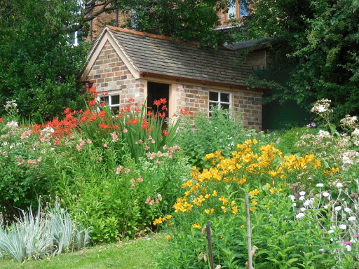 Plot 11 summerhouse with summer flowers