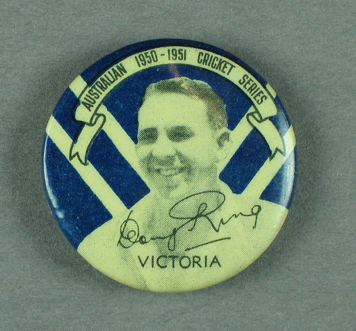 Badge, depicts Doug Ring c1950-51