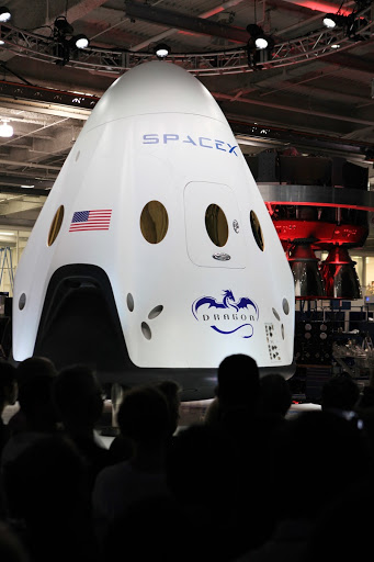The Dragon V2 stands on a stage inside SpaceX headquarters in Hawthorne Calif. during its unveiling ceremony.