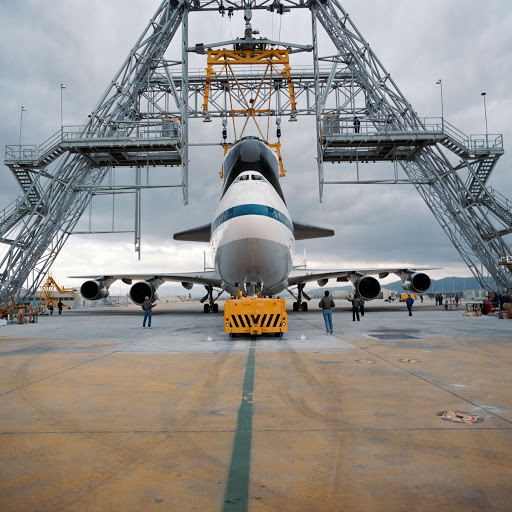 A Rockwell worker takes a technical documentation image designated NASA 911 in preparation for its first ferry flight to NASA's Kennedy Space Center.
