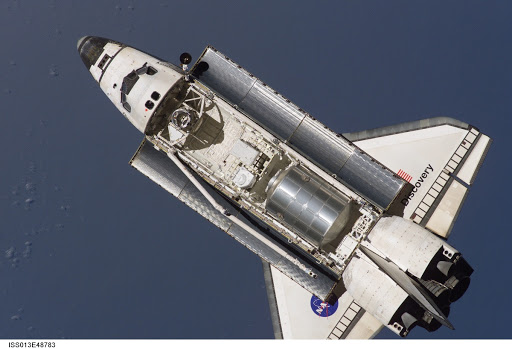 Discovery approaching the ISS for docking during the STS-121 mission