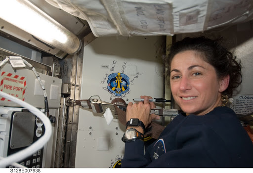 Stott signs crew patch in Joint Airlock