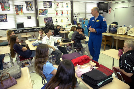 At Warrington Middle School in Pensacola Fla. astronaut Alan Poindexter talks to students.