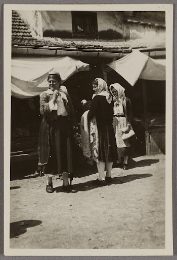 Women in traditional costume on a street in Trebinje