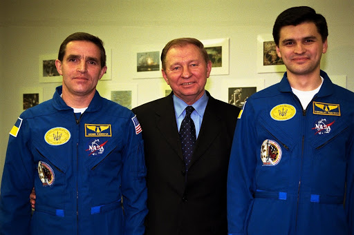 The president Leonid Kuchma is flanked by Payload Specialist Leonid Kadenyuk during prelaunch activities leading up to the launch of STS-87.