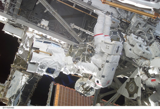 Chang-Diaz and Perrin work at the MBS on the S0 (S-zero) truss during STS-111 UF-2 EVA 2