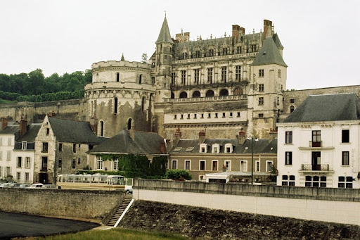 Side view of a grand chateau amidst a series of cottages, Amboise, France