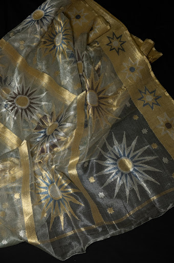 Pallu of fine banarasi kora silk sari with Sun motifs