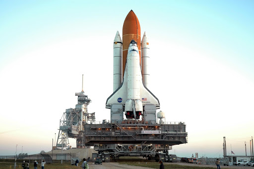 Space Shuttle Discovery on top of the mobile launcher platform and crawler-transporter passes for launch of STS-116.